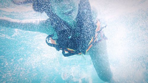 Woman swimming in sea