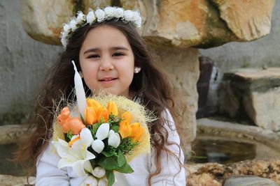 Close-up of woman holding flowers