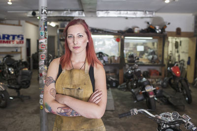 A portrait of a young woman in a dirty apron.