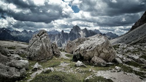 Scenic view of mountains against cloudy sky