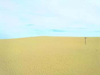 Scenic view of sand against sky