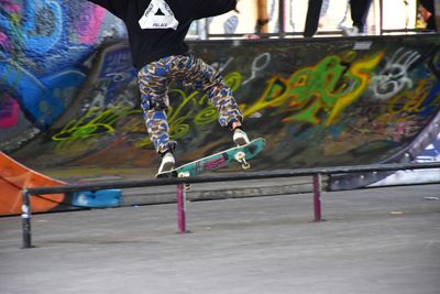 Low section of man skateboarding on skateboard