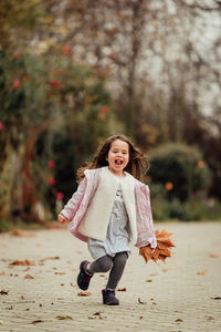 Full length of a girl smiling