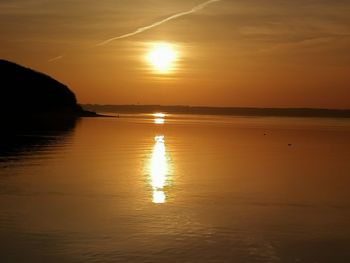 Scenic view of sea against romantic sky at sunset