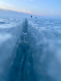 Surface level of frozen sea against sky