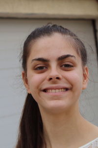 Close-up portrait of a smiling young woman