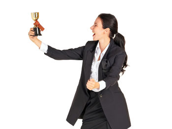 Mid section of a man drinking glass