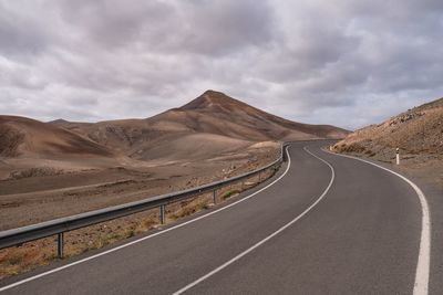 Empty road against sky