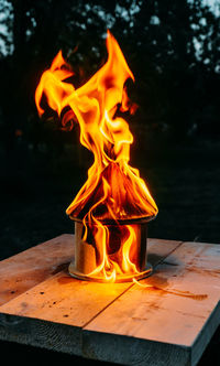 Close-up of burning fire on table