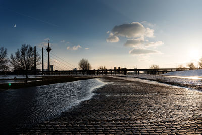 Scenic view of river against sky during winter