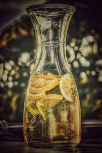 Close-up of glass bottle on table