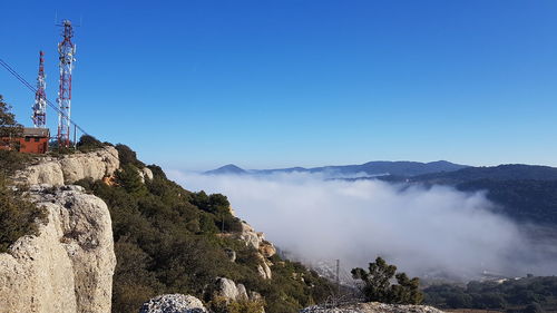 Scenic view of mountains against clear blue sky