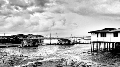 Buildings against cloudy sky