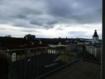 Buildings against cloudy sky