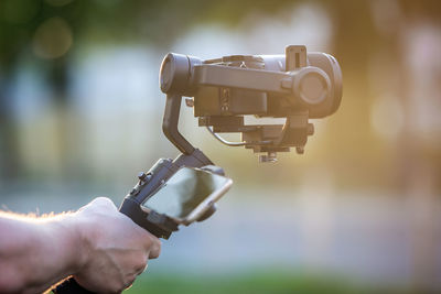Close-up of hand holding camera