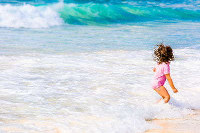 Girl looking away at beach