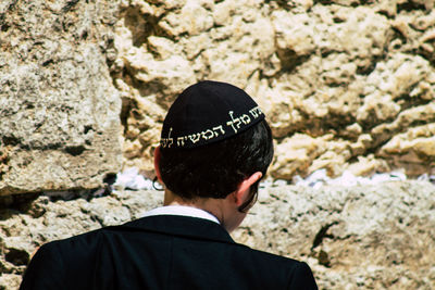 Rear view portrait of a man wearing rock
