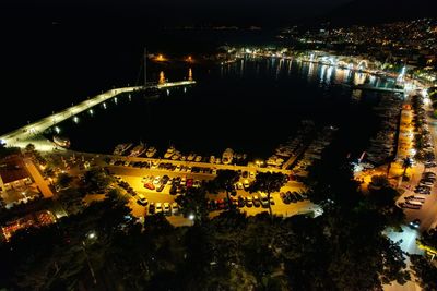 High angle view of illuminated city buildings at night