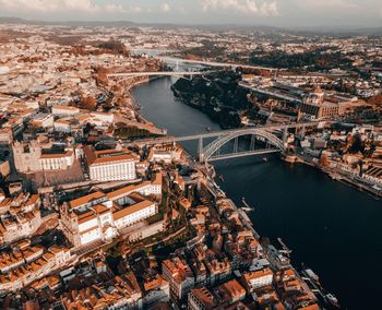 Aerial view of river amidst buildings in city