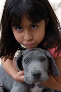 Portrait of cute girl with dog