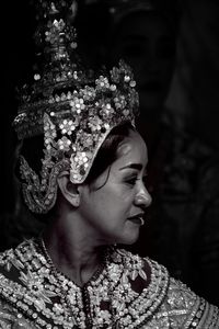 Close-up portrait of young woman looking away