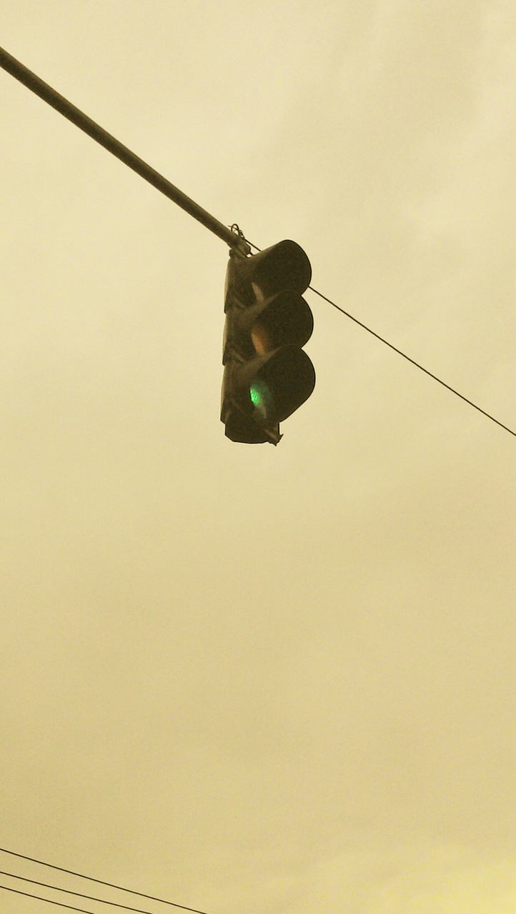 low angle view, clear sky, cable, copy space, electricity, technology, sky, power line, connection, outdoors, mid-air, hanging, lighting equipment, day, no people, flying, power supply, dusk, street light, fuel and power generation