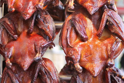 Close-up of roasted peking ducks for sale in market