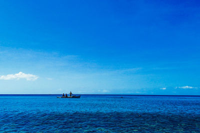 Scenic view of sea against blue sky