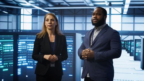 Business colleagues standing in office