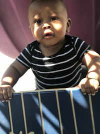 Portrait of cute baby boy at home