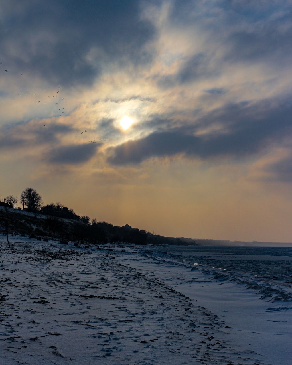 SCENIC VIEW OF BEACH DURING SUNSET