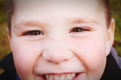 Close-up portrait of cheerful boy