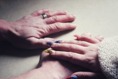 Cropped image of couple on table