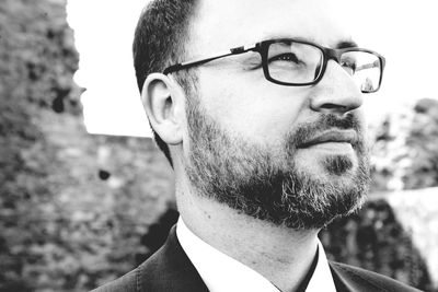 Close-up of businessman looking away outdoors