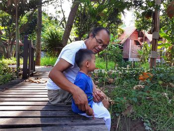 Father and son on boardwalk