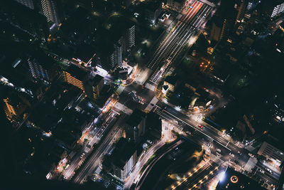 High angle view of illuminated buildings in city at night