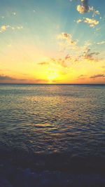 Scenic view of sea at sunset