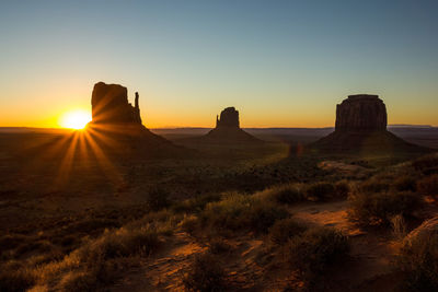 Scenic view of landscape against sky during sunset