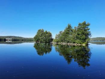 Scenic view of lake against blue sky