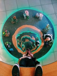 Low section of woman standing on tiled floor