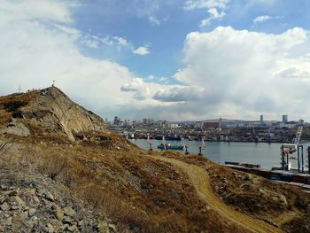 Panoramic view of sea and city against sky