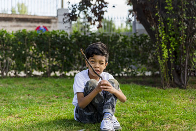 Young boy alone. having fun in a park.