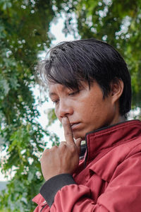 Side view of young man looking away