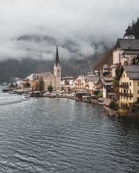 Panoramic view of buildings and city against sky