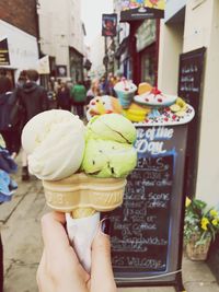 Midsection of woman holding ice cream