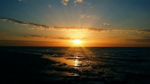 View of calm sea at sunset