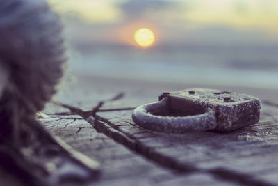 Close-up of padlock against sunset