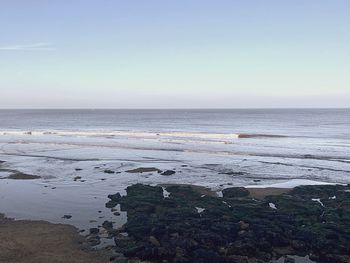 Scenic view of sea against clear sky