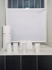 Stack of white wall in bathroom