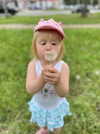 Portrait of cute girl standing outdoors